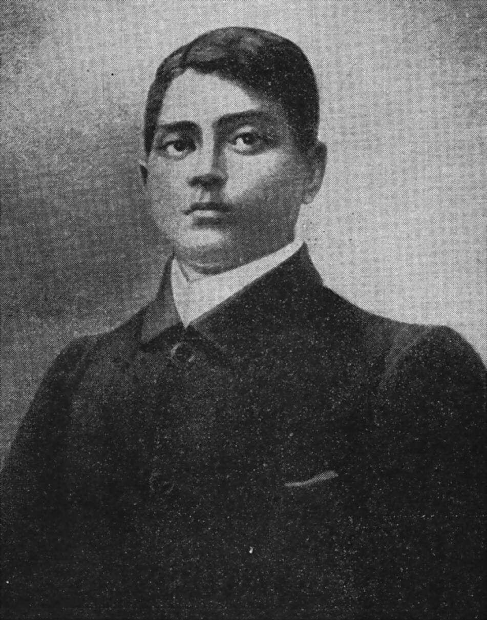 Formal portrait of Jatindranath Mukherjee in a dark high-collared coat, printed from a halftone reproduction.